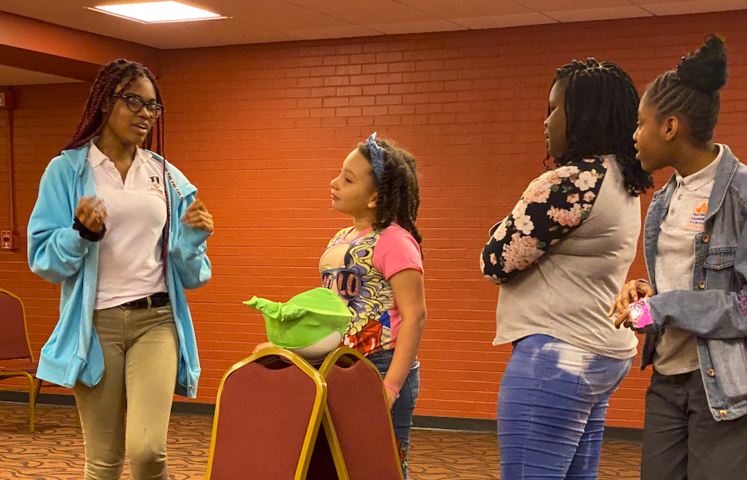 Greenmount West Community Center students during an improvisational scene with the Lyric Education team